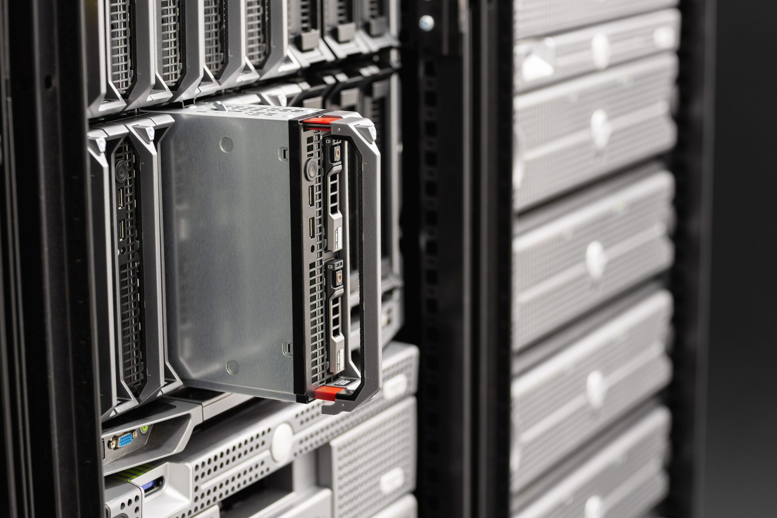 Blade server partially inserted in a data center rack, showcasing IT infrastructure relevant to Managed IT Services and Cloud solutions.