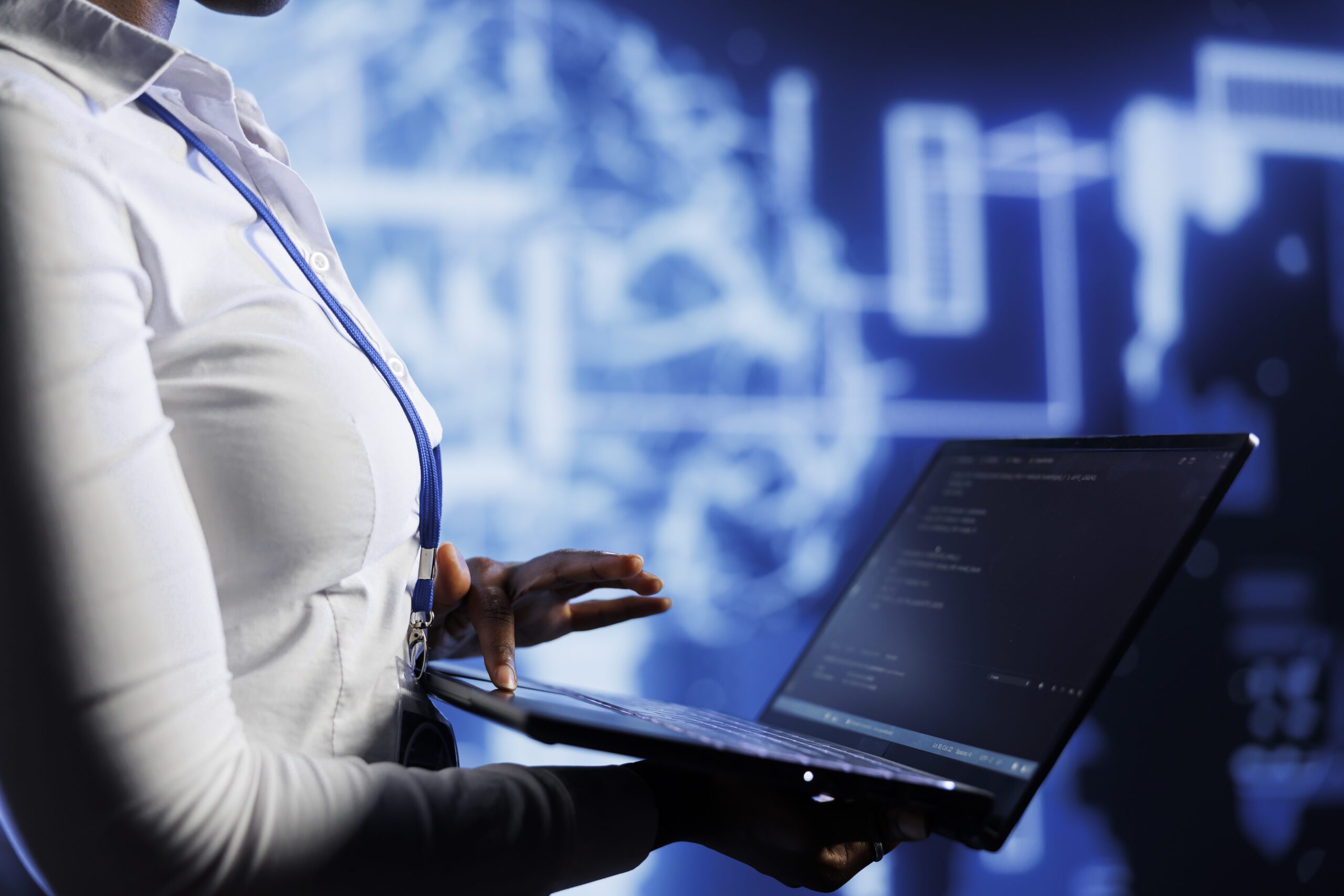 Professional examining data on laptop with AI neural network graphics in background, symbolizing ITPro Management's technology support and cybersecurity services.